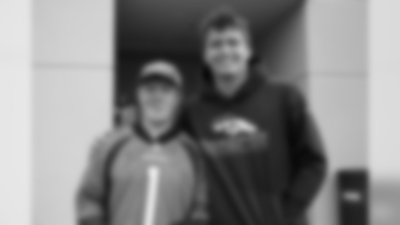 Drew Lock poses for a photo with Ethan, a Broncos fan who visited practice at UCHealth Training Center and got a tour of the facility for his Make-A-Wish, on November 1, 2019. (Photo by Ben Swanson)