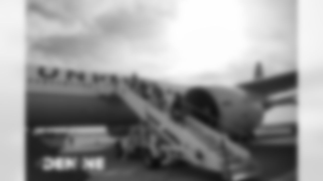 Players and staff board the plane at Denver International Airport on October 17, 2020 during the team's travel to New England for a Week 6 game against the Patriots. (Photo by Ben Swanson)
