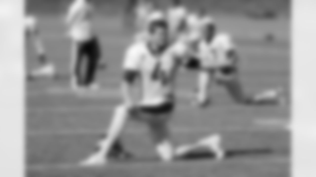 P Britton Colquitt stretches before practice.