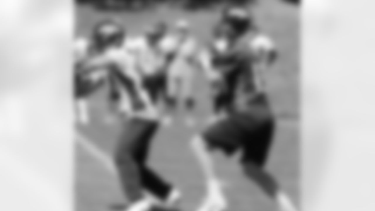 Manning looks downfield.