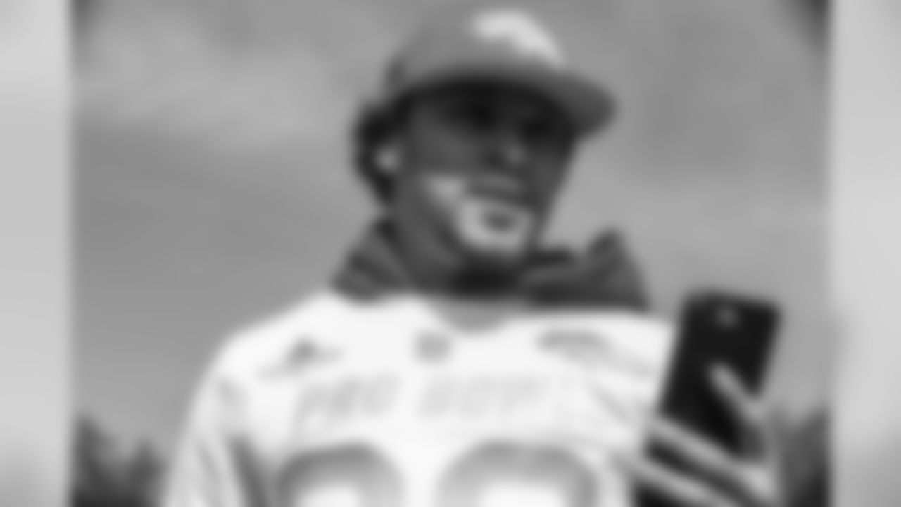 Phillip Lindsay checks his phone at the final day of Pro Bowl practice and photo day at the ESPN Wide World of Sports Complex on January 25, 2019, in Orlando, Florida.