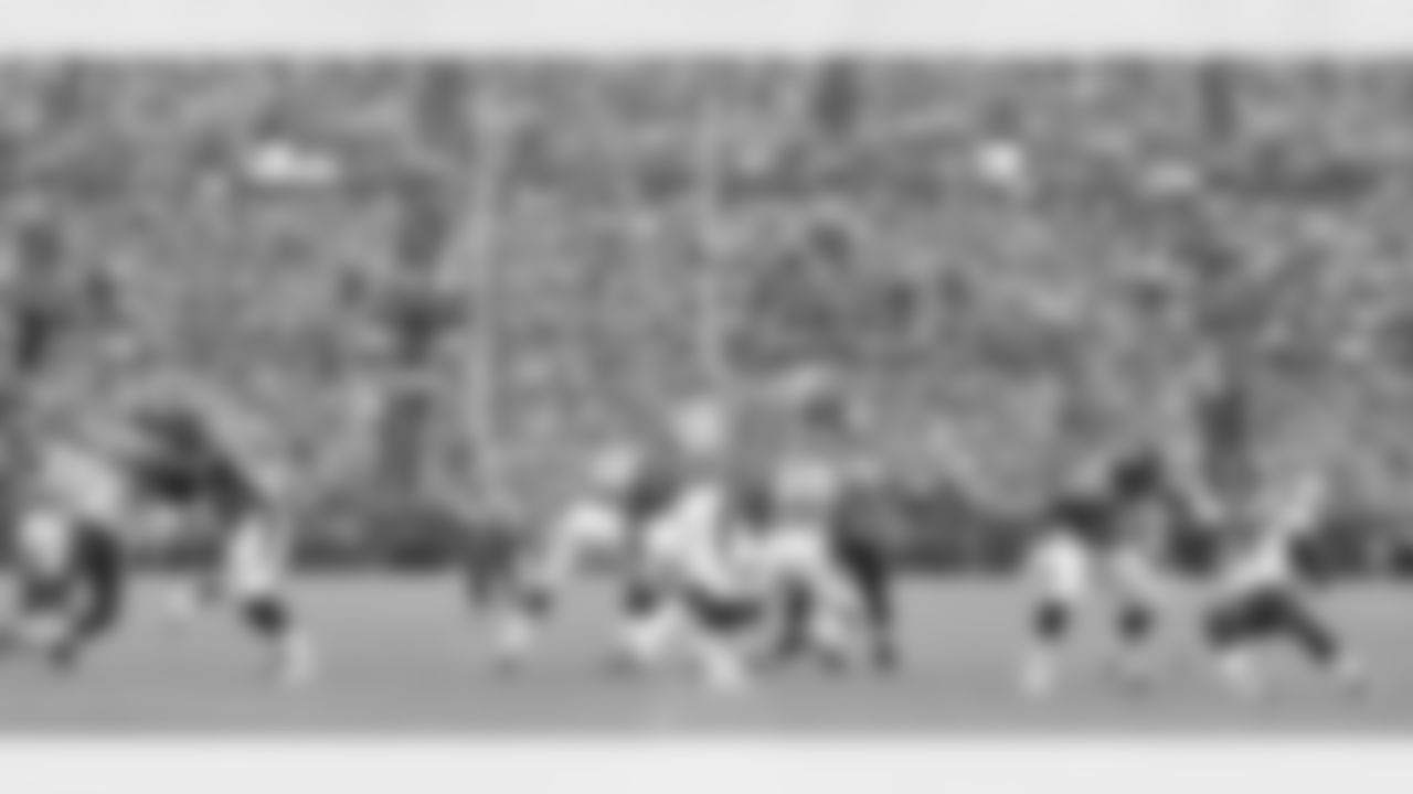 Manning fires a pass downfield. He completed 16 of 23 passes in the first half for 177 yards and two interceptions.