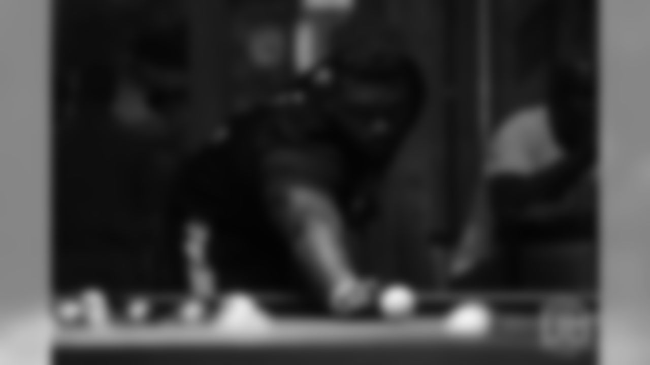 Shaquil Barrett plays pool on the first day of Von Miller's Pass Rush Summit, which included a welcome session and a night of games on June 27, 2018.