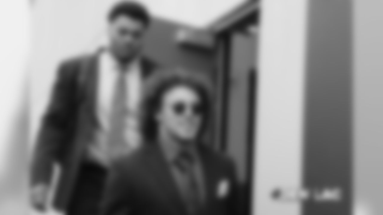 Phillip Lindsay and Elijah Wilkinson walk to the bus during the team's travel on Nov. 17, 2018 ahead of its game against the Los Angeles Chargers