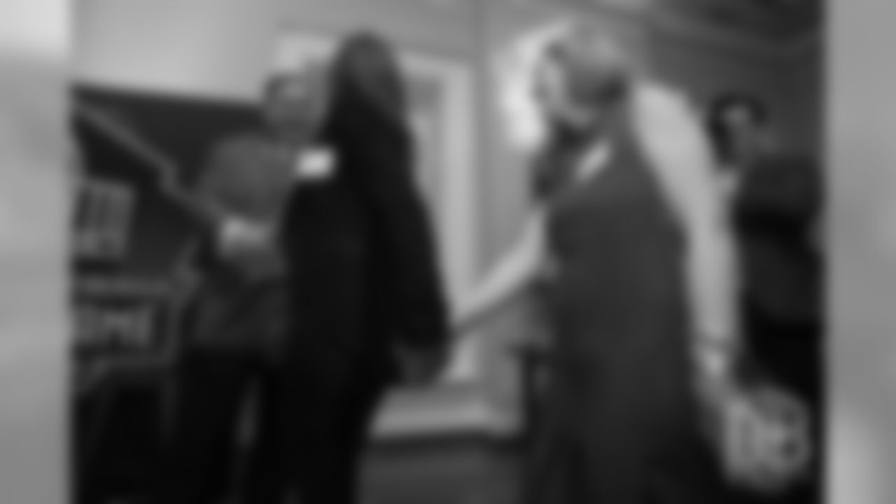 Beth Bowlen Wallace and Brittany Bowlen shake hands with President of the Pro Football Hall of Fame David Baker as he calls up the Hall of Fame finalists at the Pro Football Hall of Fame's Celebration of Excellence Reception in Atlanta on January 31, 2019.