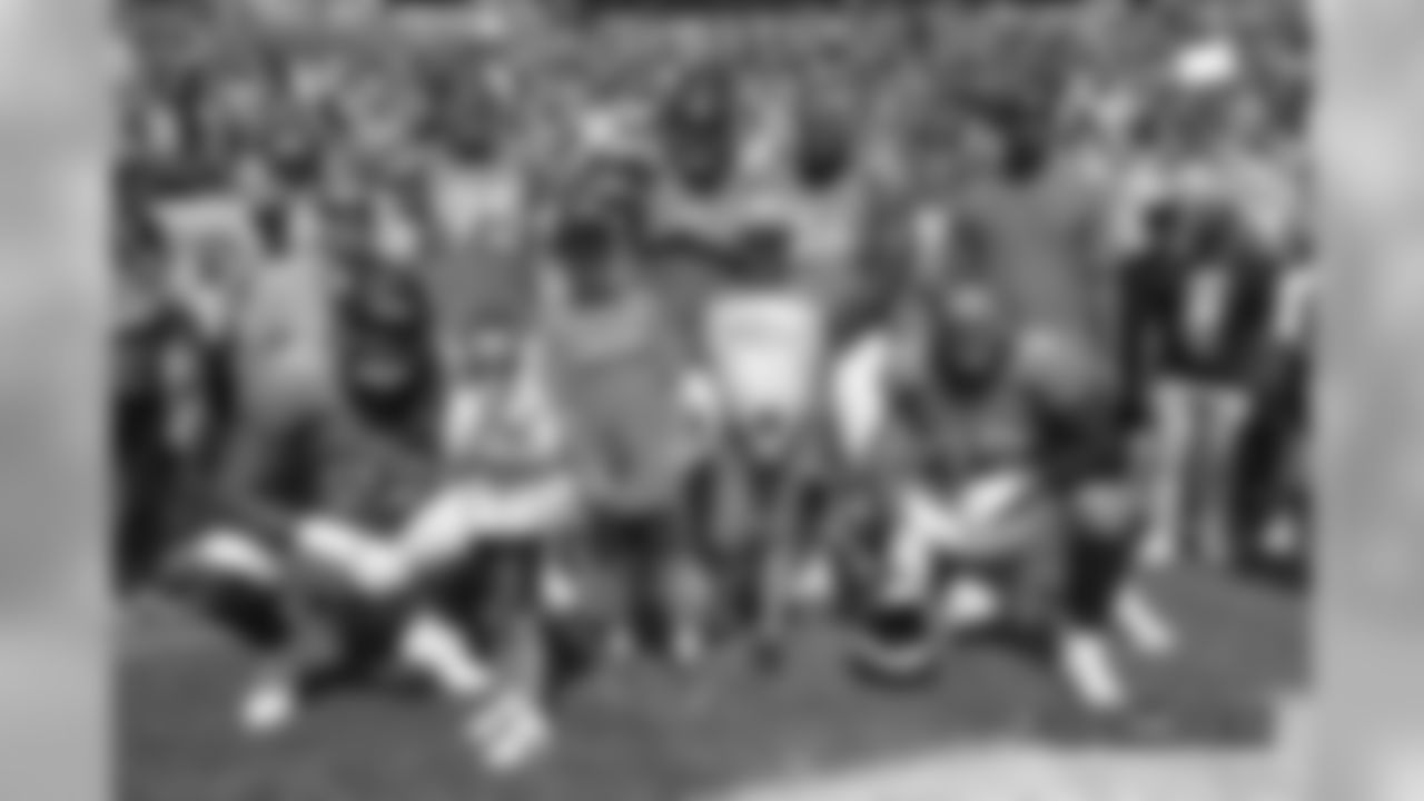 A group photo of Derek Wolfe, Domata Peko Sr., Shelby Harris, DeMarcus Walker, Zach Kerr and Adam Gotsis during pregame warmups before the Broncos' game against the Oakland Raiders at Broncos Stadium at Mile High on September 16, 2018.