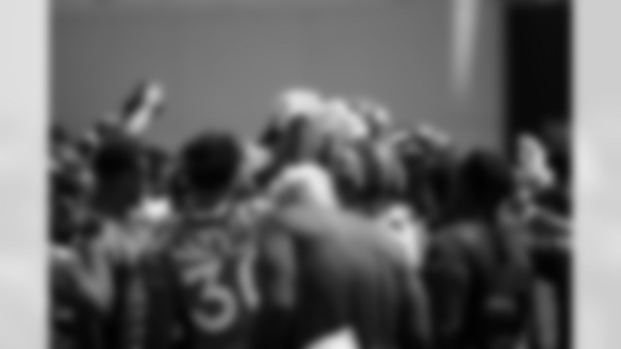 The team huddles up during a training camp practice for early reports (rookies, quarterbacks and select veterans) at UCHealth Training Center on July 25, 2021. (Photo by Ben Swanson)