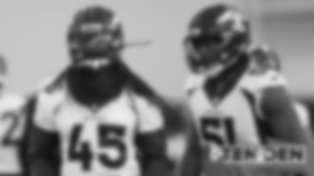 Alexander Johnson and Todd Davis at practice on October 11, 2019 at UCHealth Training Center. (Photo by Ben Swanson)
