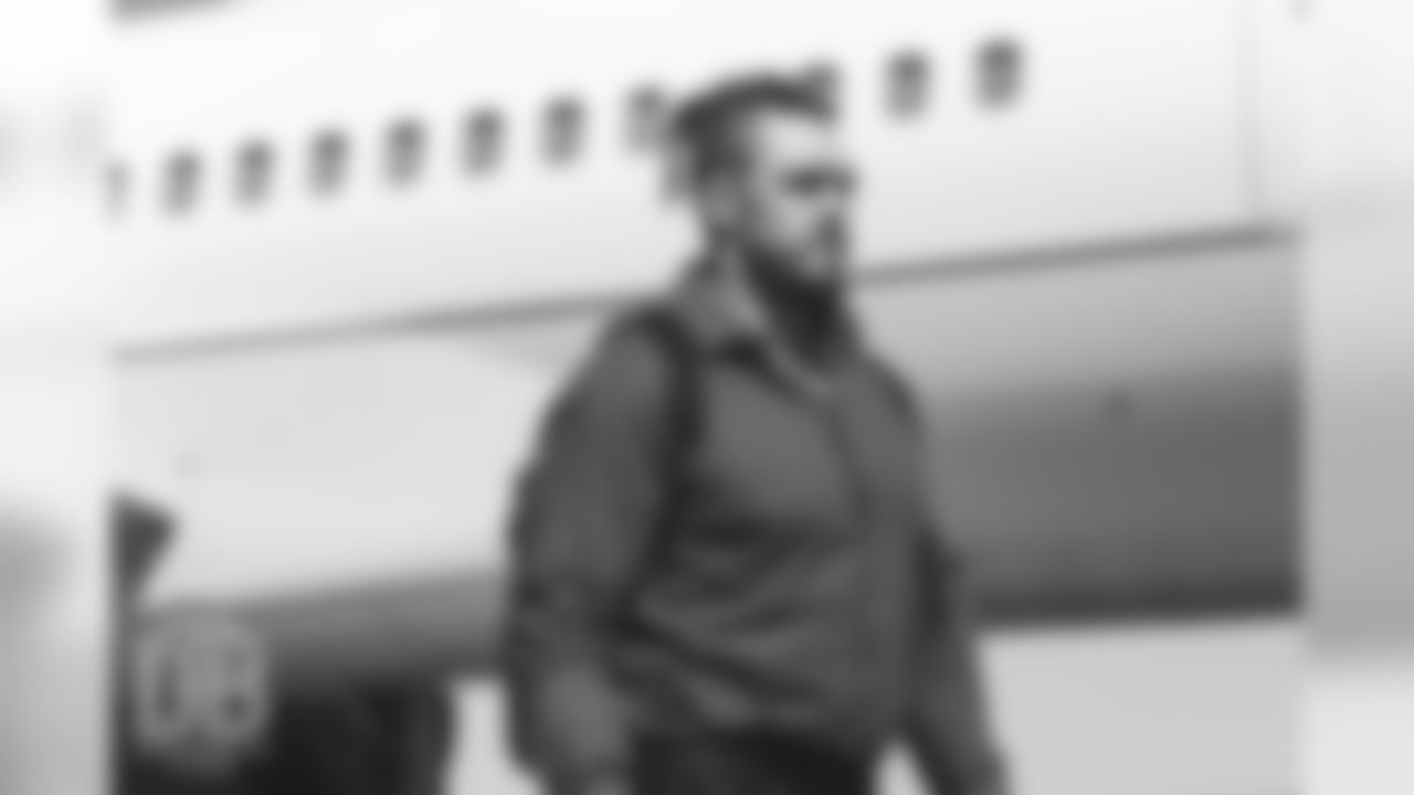 Derek Wolfe makes the walk on the tarmac to the plane during the team's travel on August 29, 2018, for their preseason game against the Arizona Cardinals.