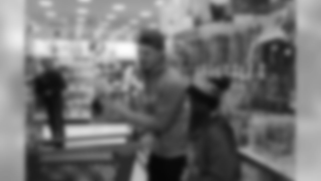 Justin Simmons helps pick out toys during Will Parks' shopping spree for the Boys & Girls Club of Metro Denver on Dec. 3, 2018
