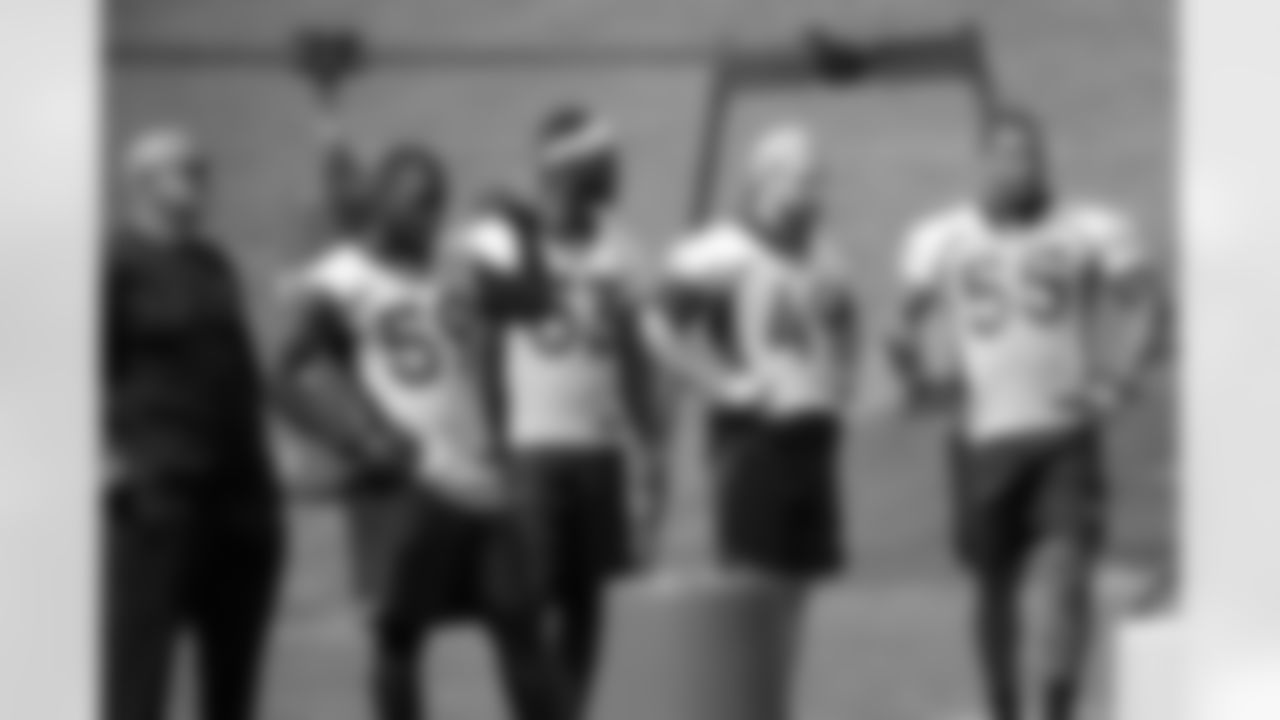 Bill Kollar, Stansly Maponga, Deiontrez Mount, Marcus Rush and Bradley Chubb stand off to the side during on-field work during Phase II of the offseason program.