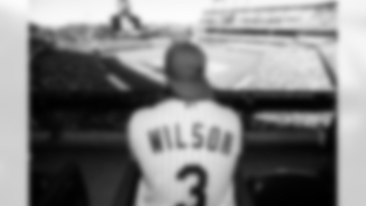 Russell Wilson watches the game during his visit to the Colorado Rockies' Opening Day game at Coors Field in Denver, Colorado on April 8, 2022. (Photo by Ben Swanson)