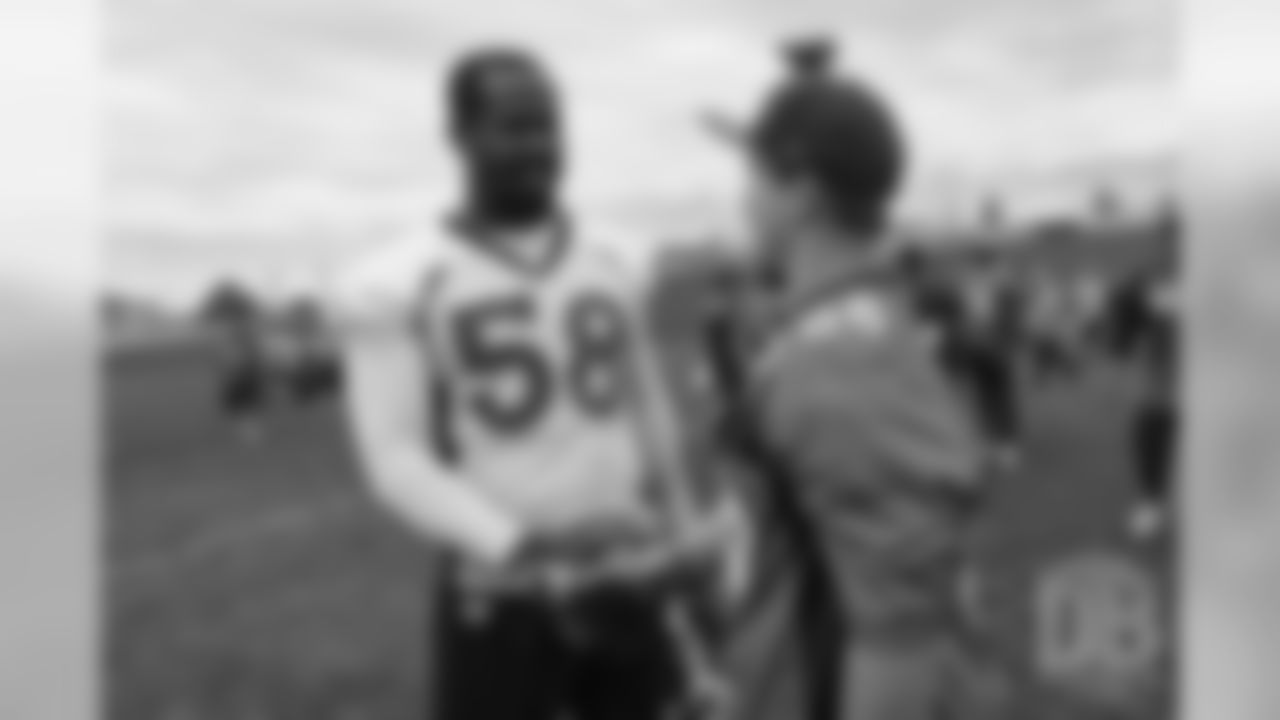 TJ, a 12-year-old fighting cystic fibrosis, wanted to be Von Miller for a day, and the Make-A-Wish Foundation helped make that dream come true on September 29, 2018. Here, TJ meets Miller after practice.
