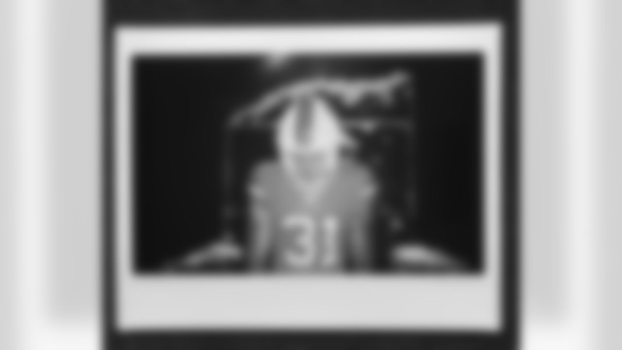 Justin Simmons in an instant film photo during a video production shoot for the unveiling of the alternate helmet at Centura Health Training Center on June 20, 2023 in Englewood, Colorado. Photo by Joe Abdellah / Denver Broncos
