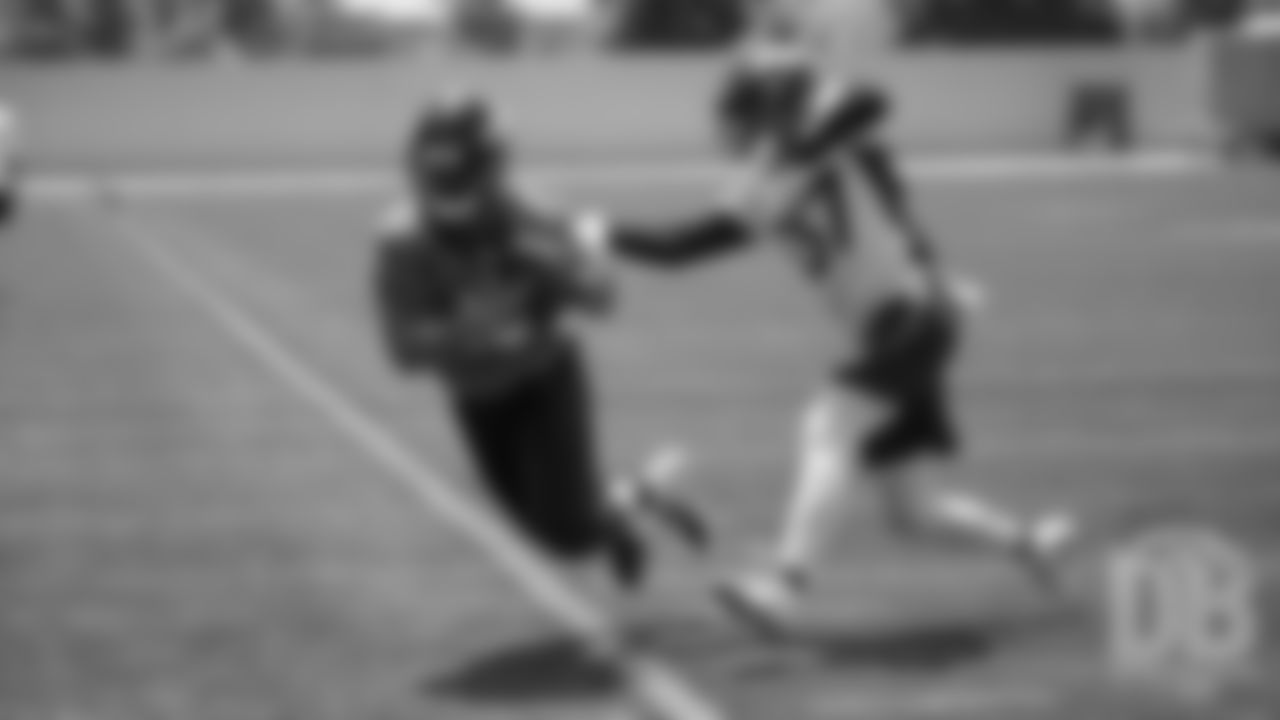 Aaron Burbridge tries to hang on to a sideline throw during the Broncos' practice on the ninth day of their OTAs on May 31, 2019.