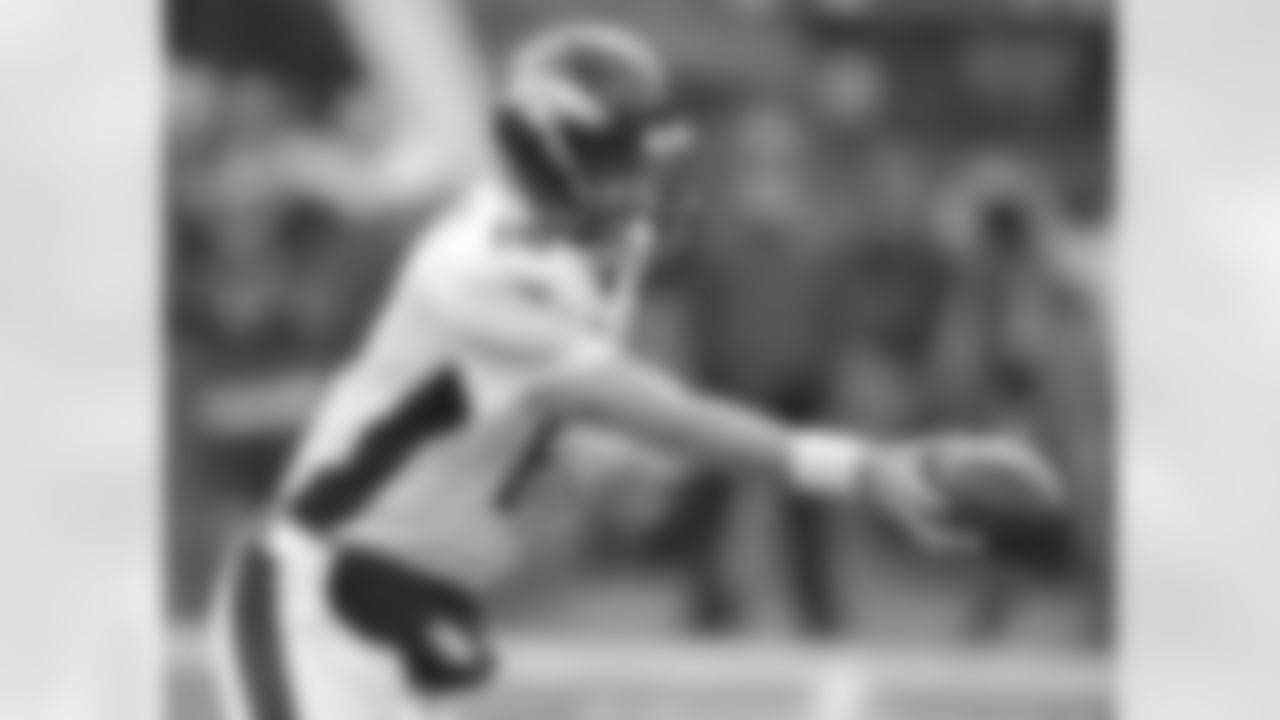Manning looks to hand it off.