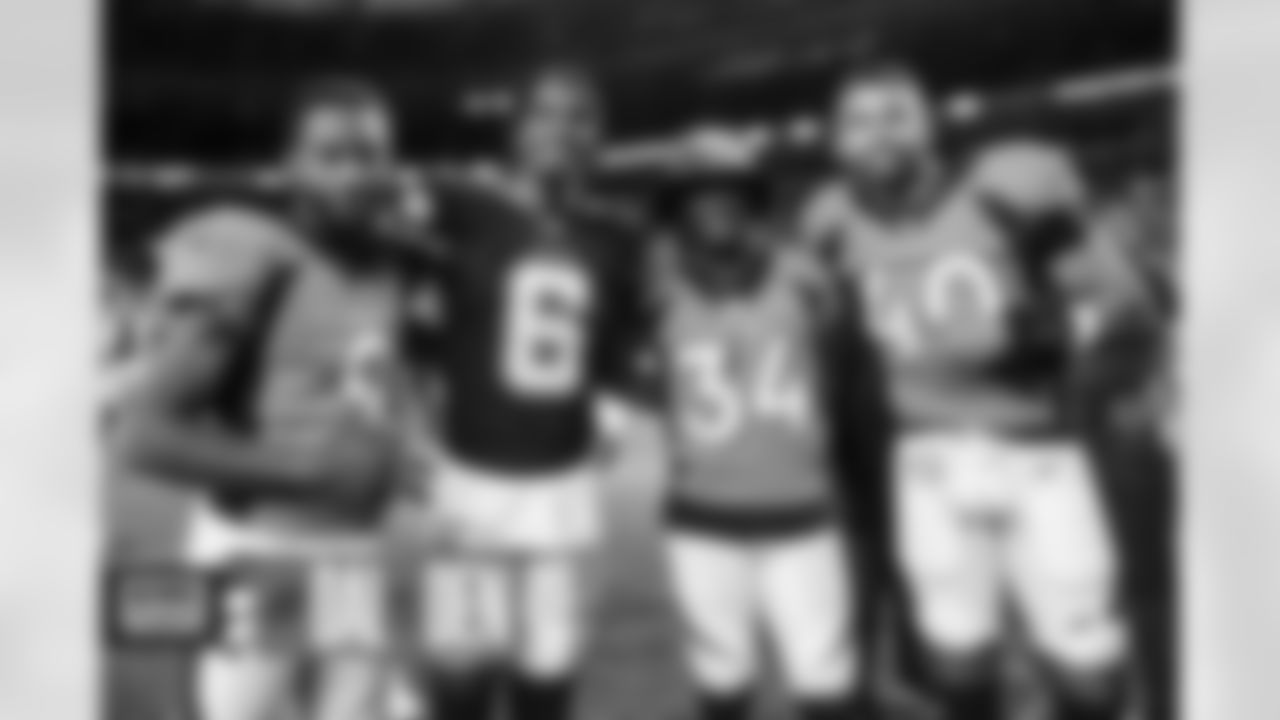 Kendall Hinton, Essang Bassey and Justin Strnad with Jaquarii Roberson after the Broncos' preseason Week 1 game against the Dallas Cowboys at Empower Field at Mile High in Denver, Colorado on August 13, 2022. (Photo by Ben Swanson)