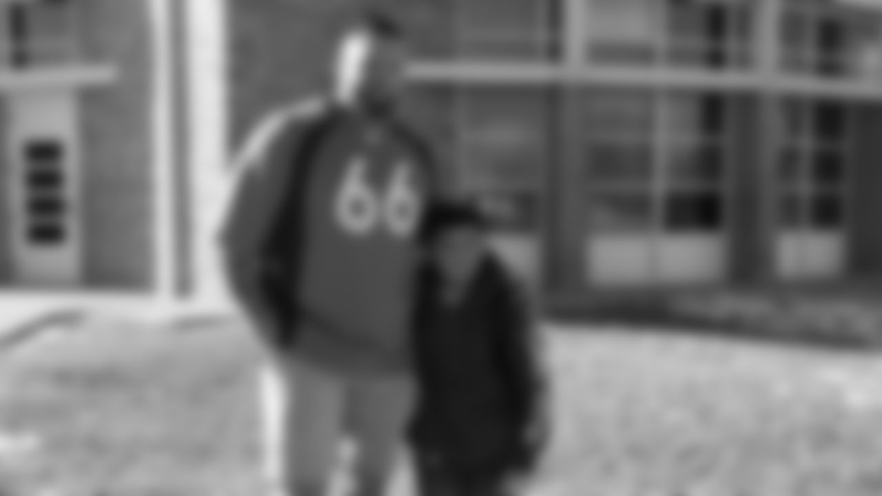 Dalton Risner poses with a student after helping him pick up trash at North Middle School in Aurora, Colorado for a Character Playbook School Service event on December 9, 2019. (Photo by Emily Simanskis)