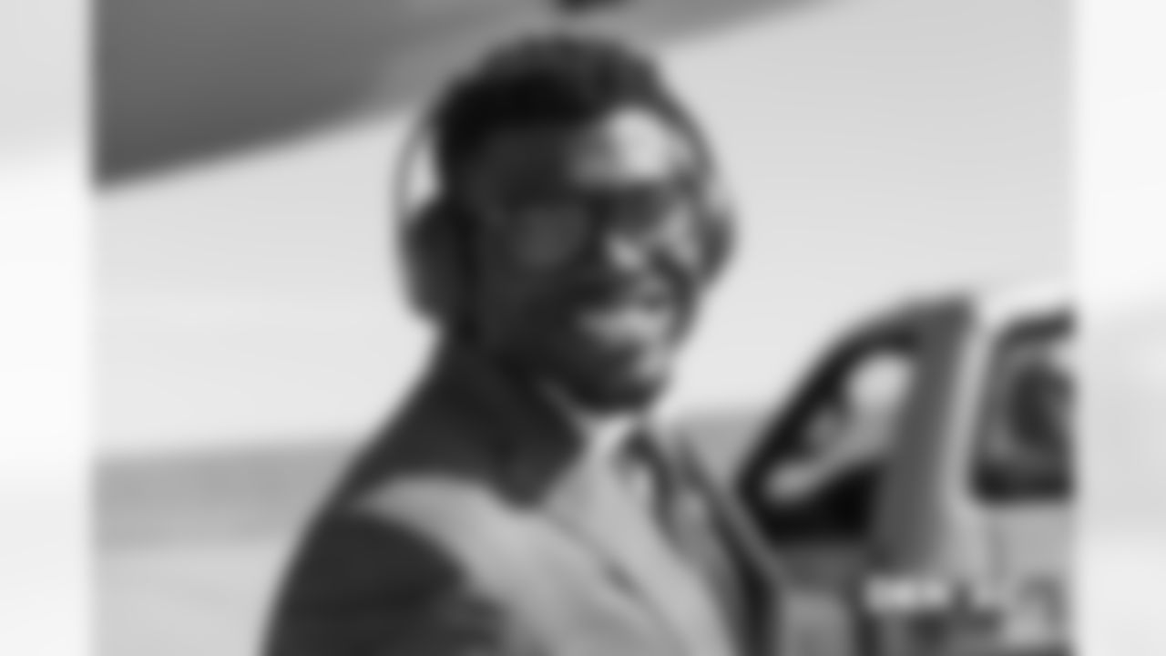 Dymonte ThomasÊwalks on the tarmac to the plane before the flight during the team's travel for their Week 8 game against the Kansas City Chiefs on October 27, 2018.