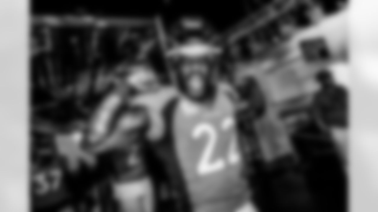 Kareem Jackson flexes in the tunnel during player and team introductions before the game against the Baltimore Ravens on October 3, 2021 at Empower Field at Mile High in Denver, Colorado. (Photo by Ben Swanson)