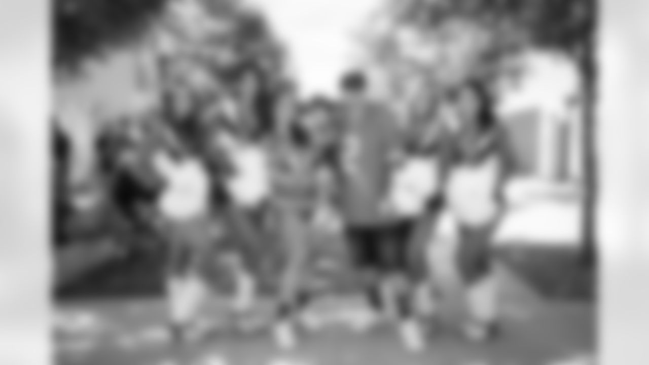 Fans pose for a photo with DBC Mary Kate, DBC Sophia F, DBC Zoe and DBC Alison A during a training camp practice at Centura Health Training Center on July 29, 2023 in Englewood, Colorado. Photo by Ben Swanson / Denver Broncos