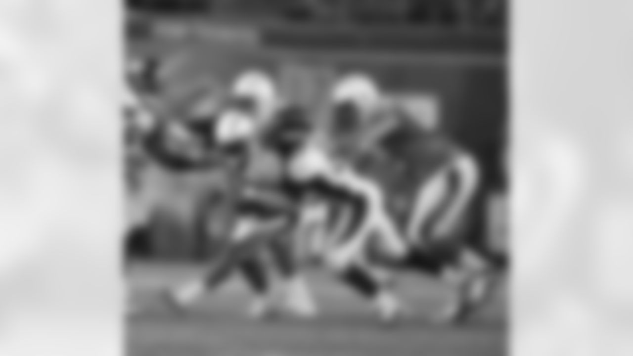 LB Keith Brooking wraps up the Chargers ball carrier.