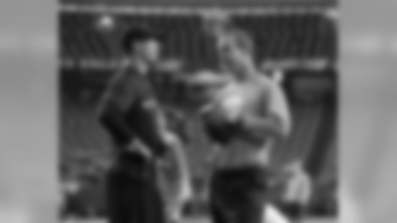 QB Peyton Manning chats with Atlanta QB Matt Ryan during warmups for the Broncos-Falcons game.