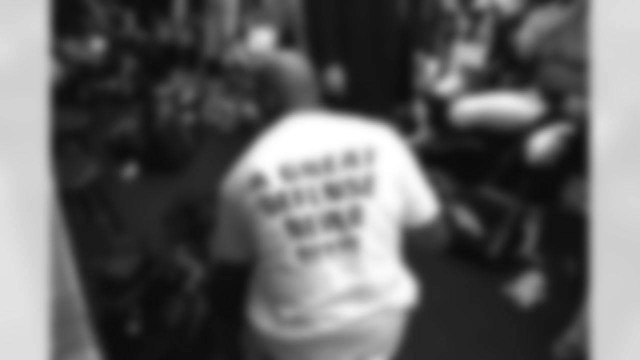 Kansas City: A player wears his "A great defense never rests" t-shirt in the locker room after the Broncos win against the Chiefs against the Kansas City Chiefs at Arrowhead Stadium in Kansas City, MO on January 4, 1998.