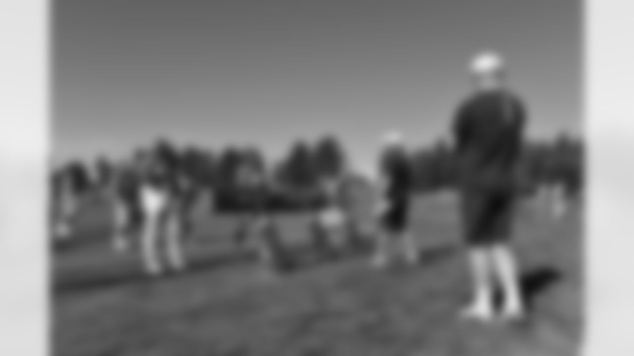 Karl Mecklenburg watches the D-line go through drills.