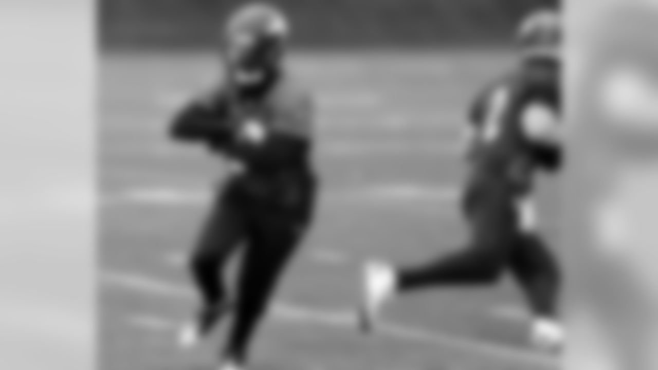 RB Ronnie Hillman works on a play-action drill with QB Adam Weber.