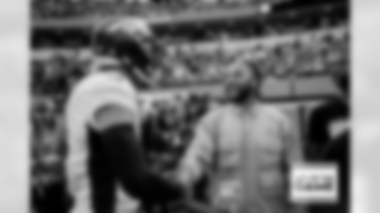 Justin Simmons greets former Bronco T.J. Ward during pregame warmups before the Broncos' Week 16 game against the Los Angeles Rams at SoFi Stadium in Inglewood, California on December 25, 2022. Photo by Ben Swanson/DenverBroncos.com
