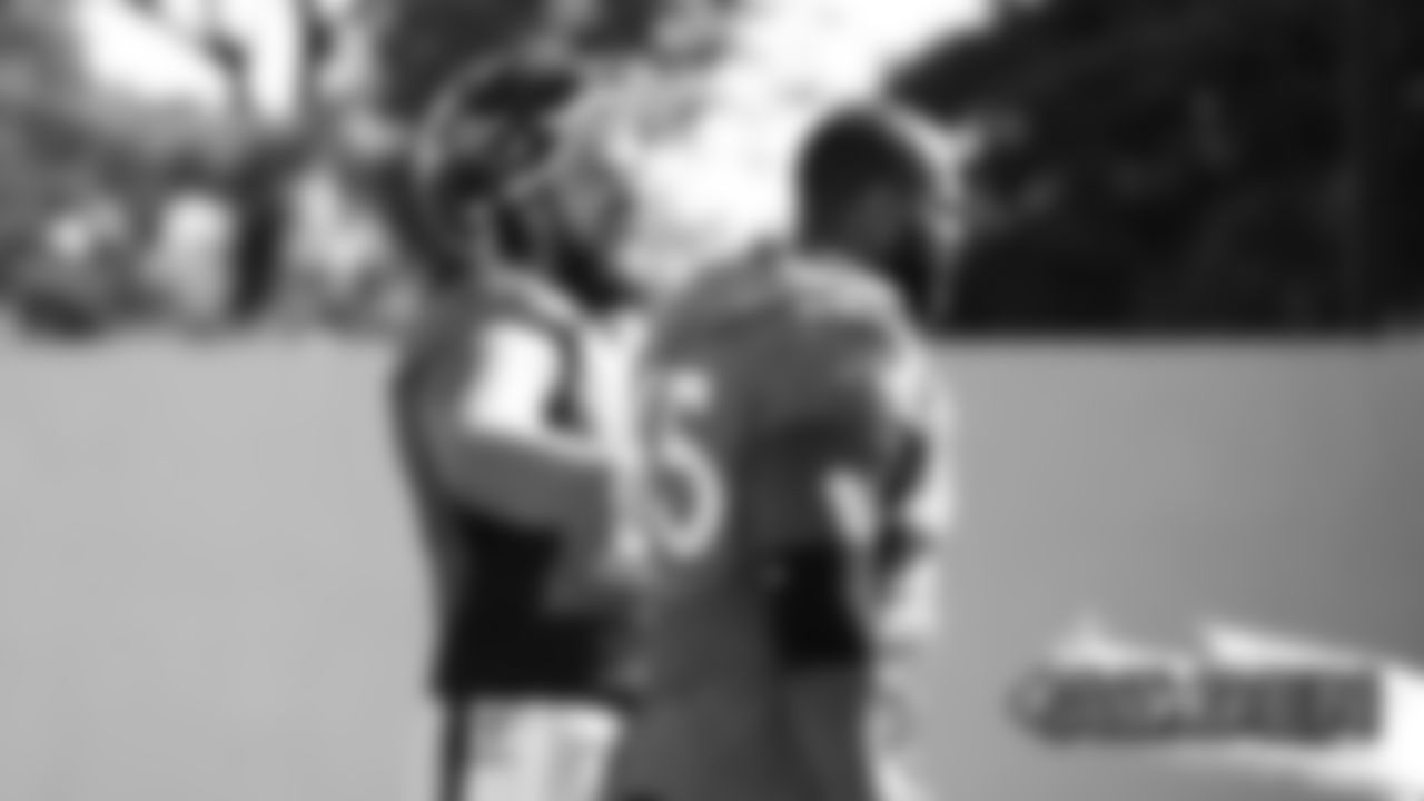 Connor McGovern laughs as he talks with Ron Leary at practice at UCHealth Training Center on August 26, 2019. (Photo by Ben Swanson)