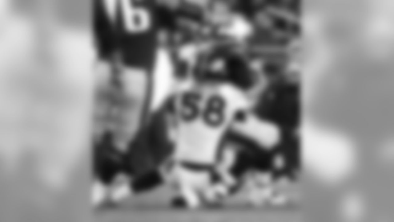 Miller collects one of his two sacks of Tom Brady during the game.