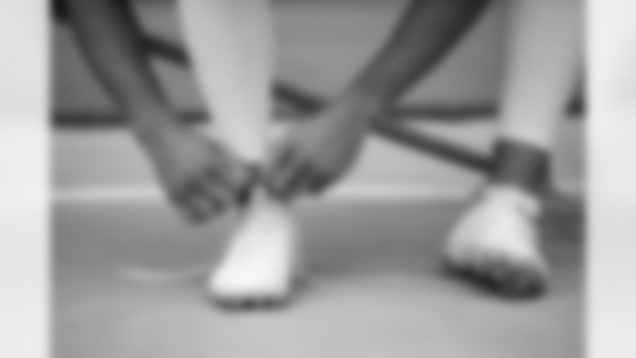 Sam Martin ties his shoes before practice on Day 12 of training camp at Empower Field at Mile High on August 29, 2020. (Photo by Ben Swanson)