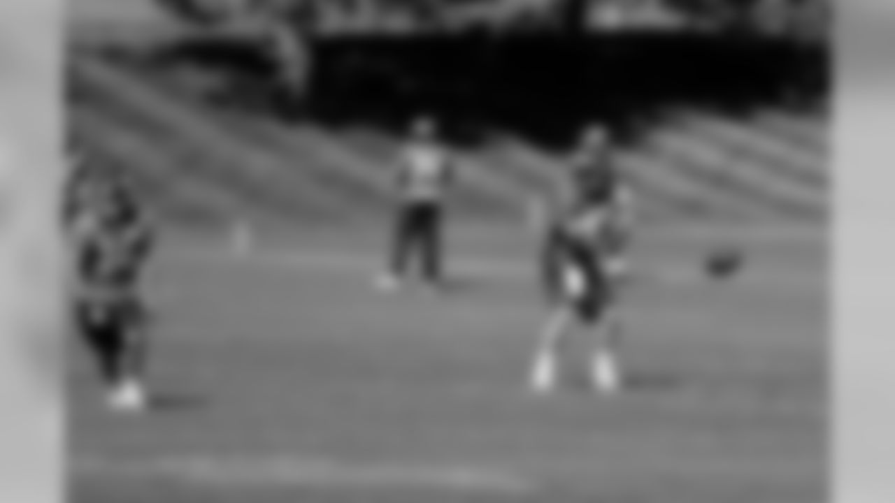 Manning takes a snap as WR Brandon Stokley runs a route.