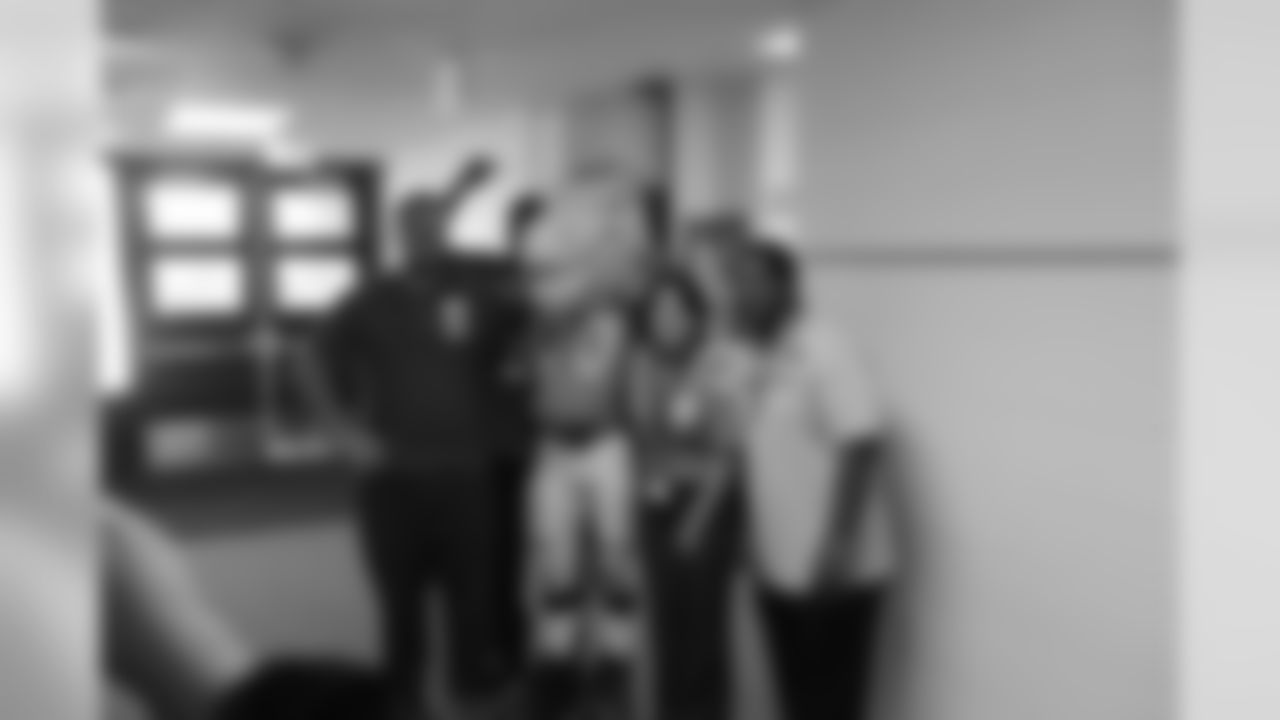 Miles poses for a shot with some faculty members.