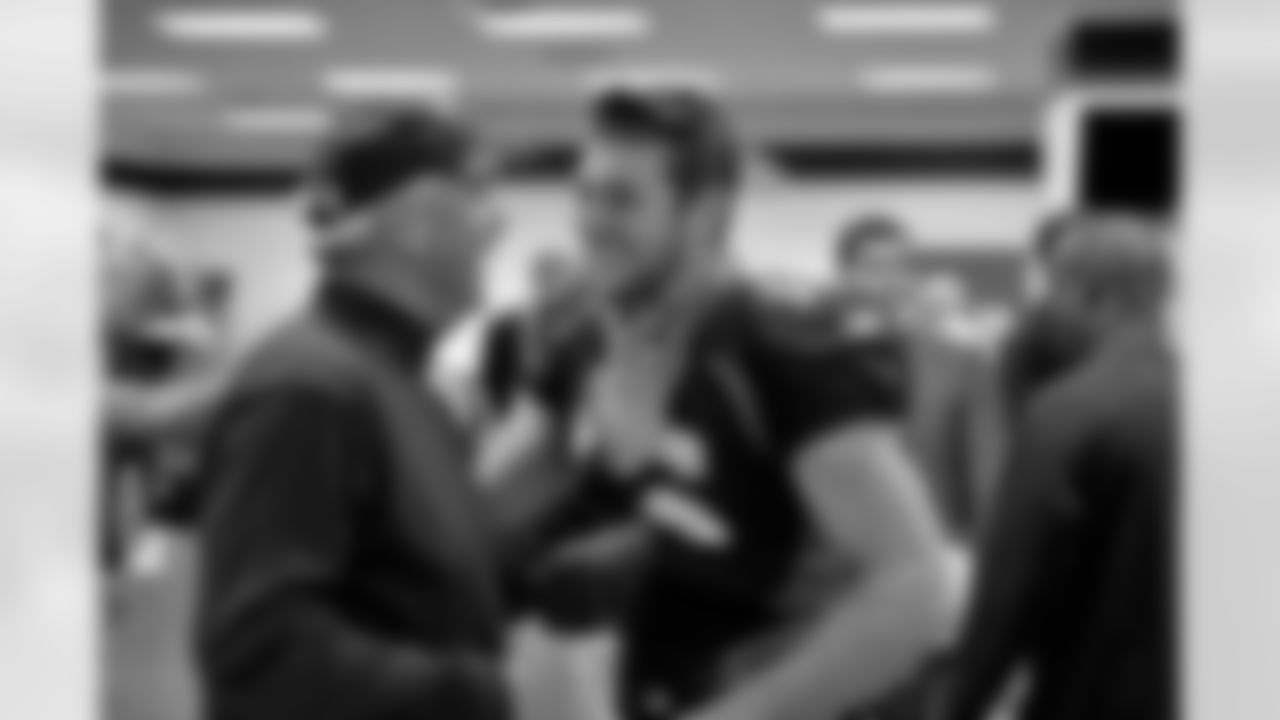 Denver Broncos Head Coach John Fox celebrates with Tim Tebow (15) in the locker room after Denver defeated the New York Jets 17-13 in the NFL game at Sports Authority Field at Mile High November 17, 2011in Denver,Co.