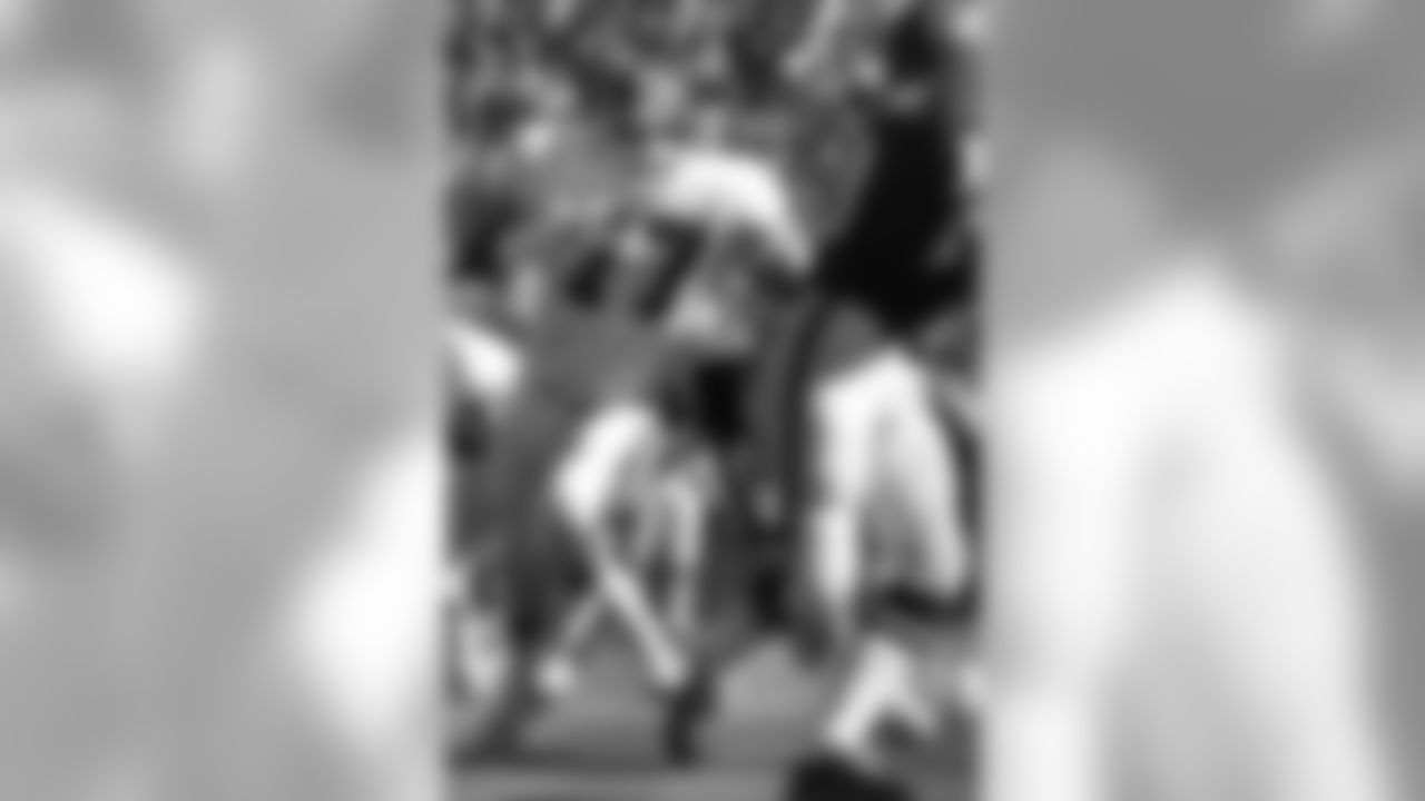 Defensive tackle Lyle Alzado rushes Chiefs quarterback Mike Livingston during a game in Kansas City.
