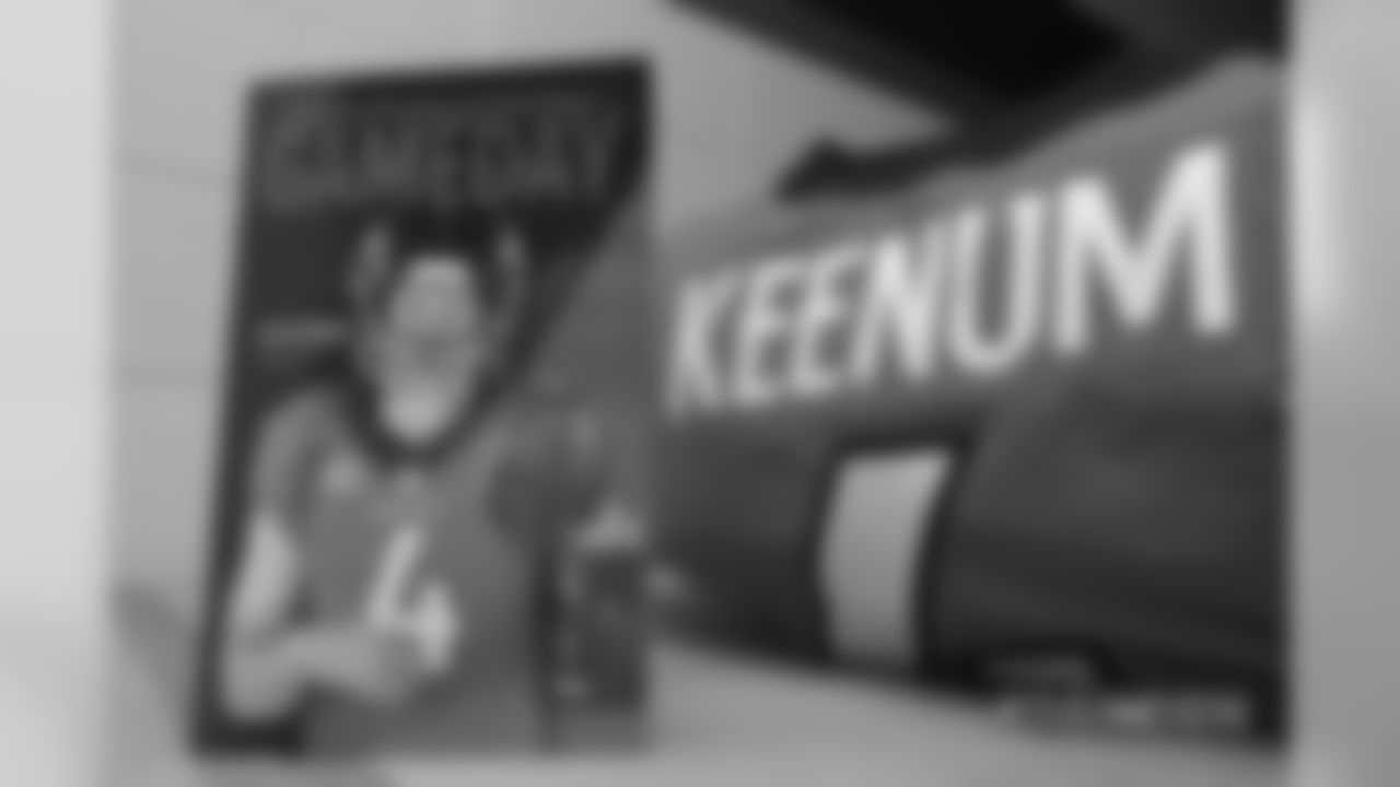 Case Keenum on the Gameday Magazine cover in the locker room pregame before the Broncos' Week 2 game against the Oakland Raiders at Broncos Stadium at Mile High on September 16, 2018.