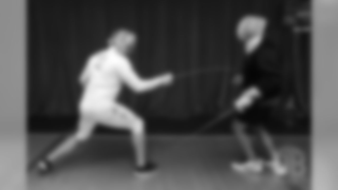 Brandon McManus and Casey Kreiter try their hands at fencing at the Denver Fencing Center on July 17, 2018.