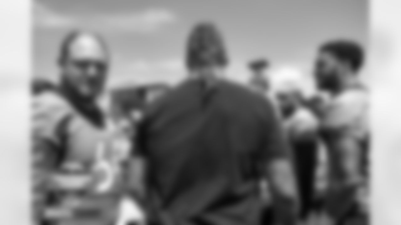 Derek Wolfe heads to the center of the team huddle to speak to the team at practice on Day 3 of training camp at UCHealth Training Center in Englewood, Colorado on July 29, 2022. (Photo by Ben Swanson)