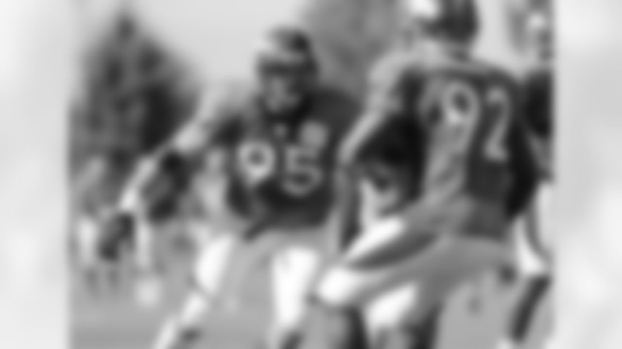 DE Derek Wolfe gets ready to wrap up Dumervil.