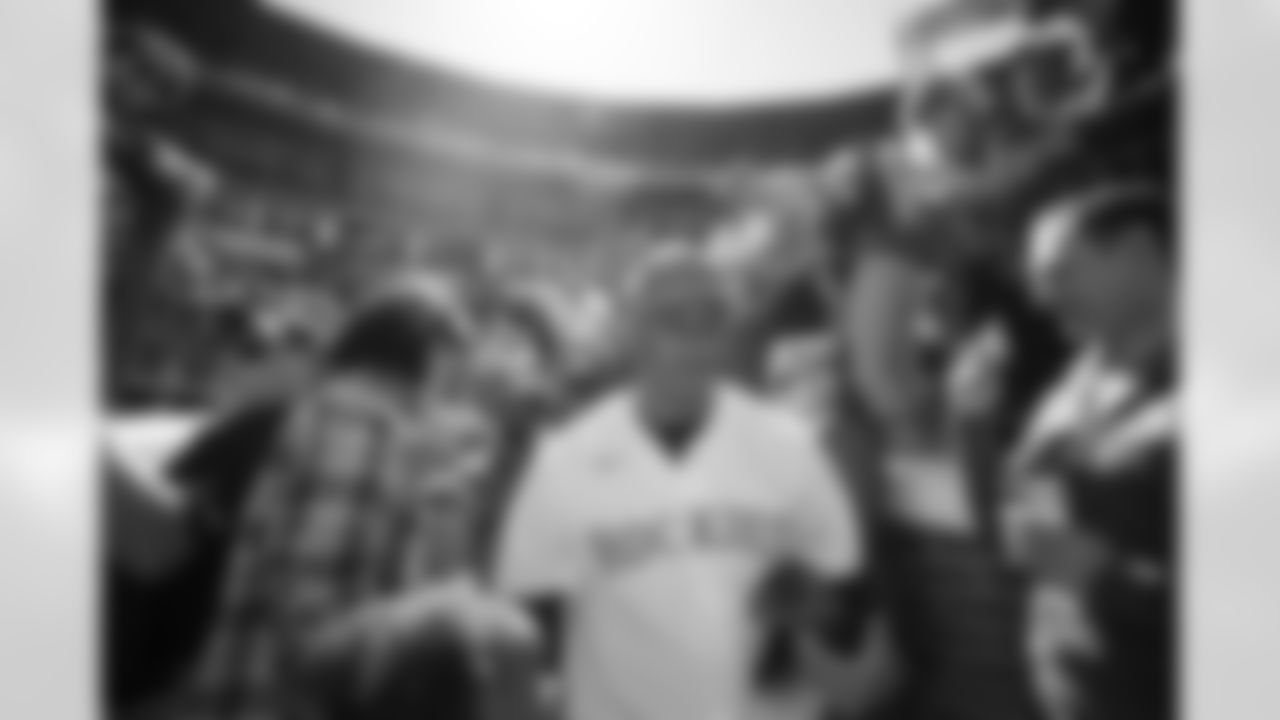Russell Wilson walks out to the field during his visit to the Colorado Rockies' Opening Day game at Coors Field in Denver, Colorado on April 8, 2022. (Photo by Ben Swanson)