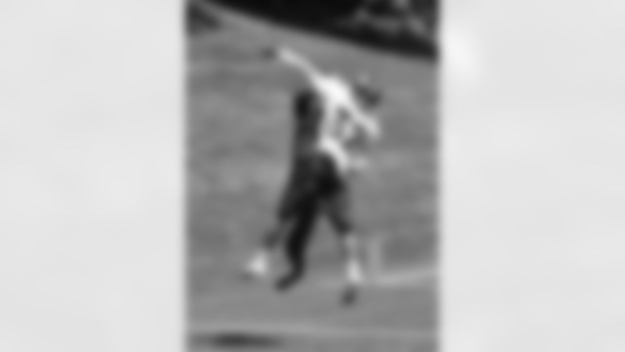 CB Tony Carter defends a pass from QB Peyton Manning.