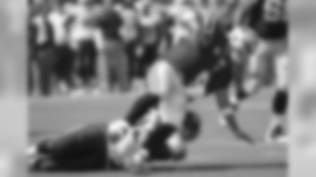 Dallas Cowboys quarterback Tony Romo (9) is sacked by Tennessee Titans defensive end Jurrell Casey (99) for a 12-yard loss in the first quarter of an NFL football game Sunday, Sept. 14, 2014, in Nashville, Tenn. (AP Photo/Mark Zaleski)