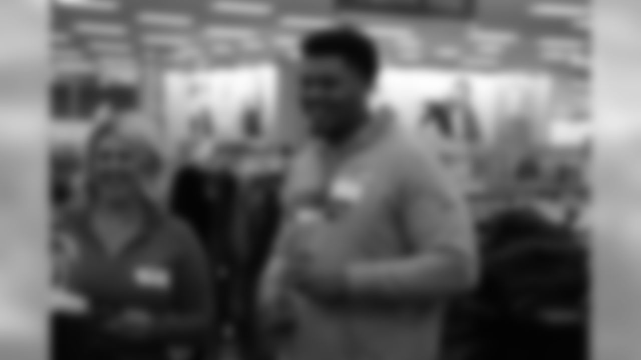 Elijah Wilkinson shares a laugh during Will Parks' shopping spree for the Boys & Girls Club of Metro Denver on Dec. 3, 2018
