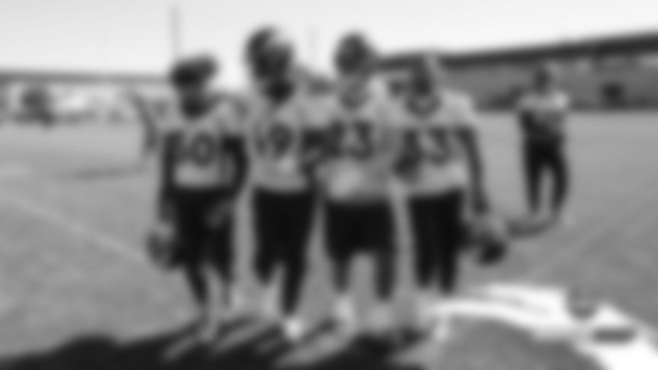 Phillip Lindsay, Dave Williams, Devontae Booker and Khalfani Muhammad before practice on Day 14 of training camp on August 6, 2019.