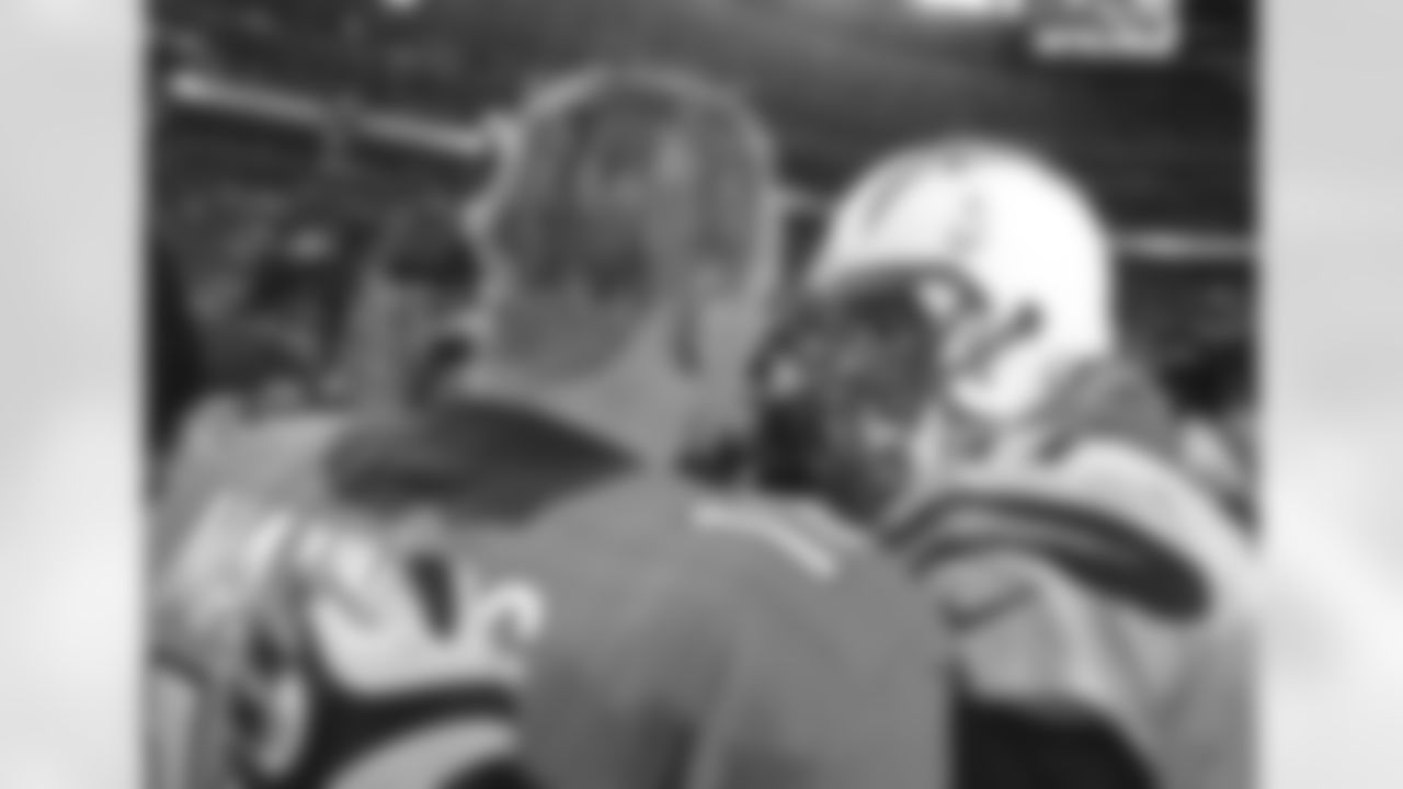 Denver Broncos quarterback Peyton Manning (18) shakes hands with San Diego Chargers quarterback Phillip Rivers (17) after the game against the San Diego Chargers in an AFC divisional playoff NFL game at Sports Authority Field in Denver, CO on January 12, 2014.
Photo by Gabriel Christus