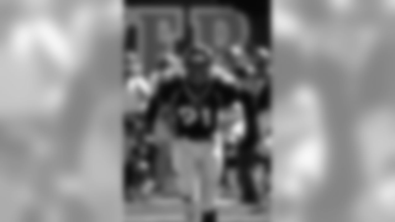 Alfred Williams charges onto the field before the game against the Kansas City Chiefs at Mile High Stadium in Denver, CO on August 31, 1997.