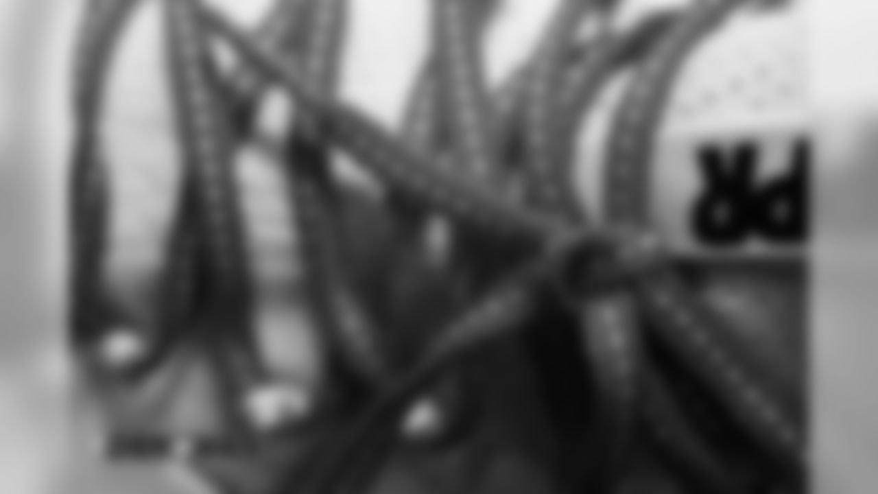 A closer look at the shoelaces on a pair of cleats in the locker room pregame before the Broncos' preseason game against the Washington Redskins at FedExField on August 24, 2018.